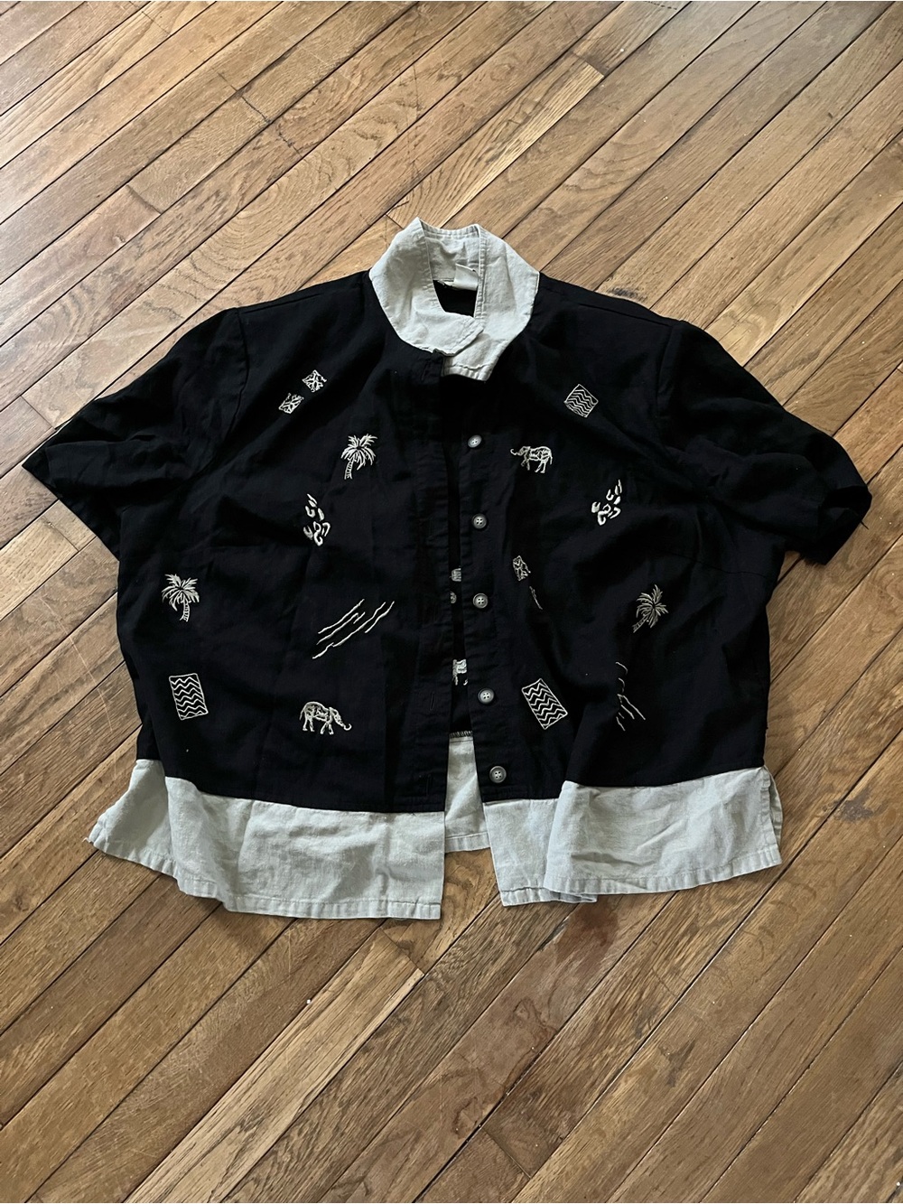 Black Button-Up Shirt with White Embroidery and Contrast Hem